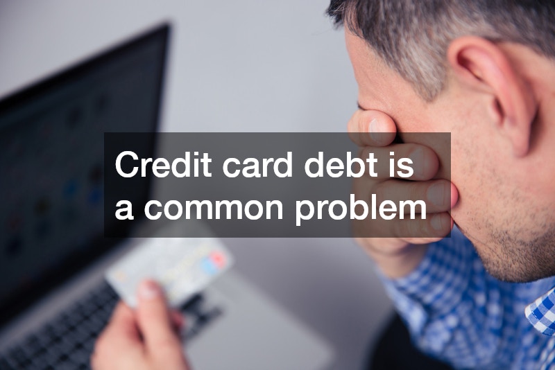 stressed man holding a credit card